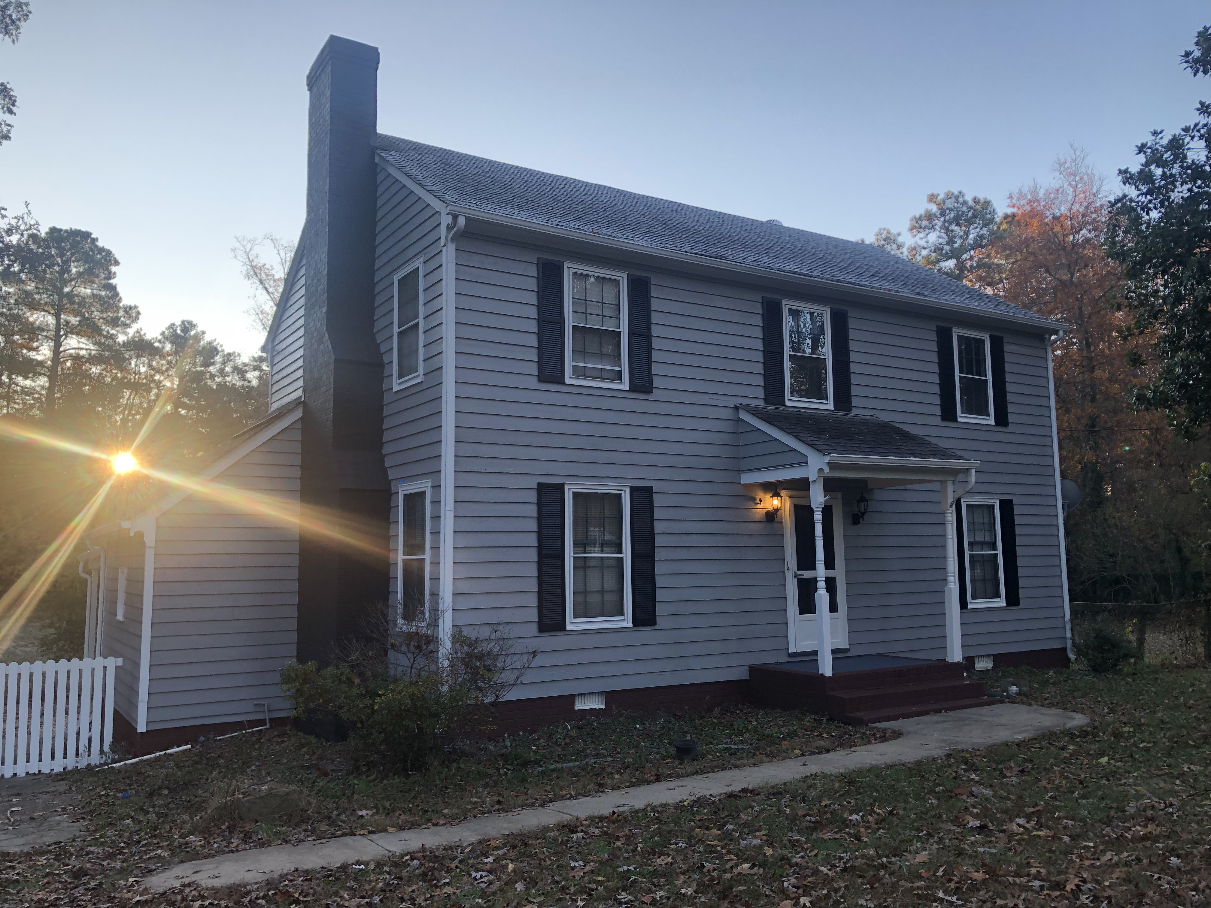 Exterior of house after painting — fresh, clean coating